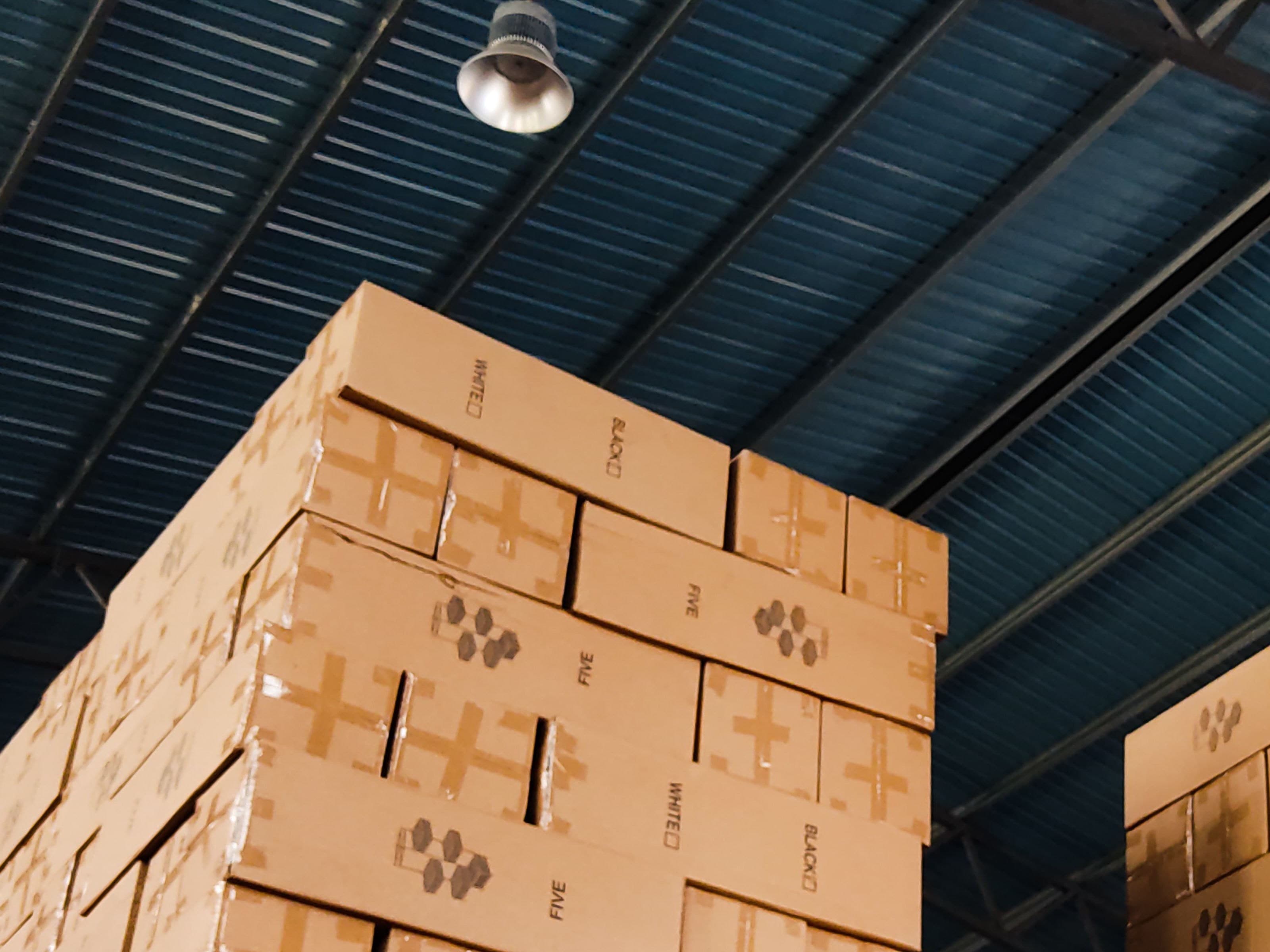 Packed custom order cartons staged for dispatch and delivery